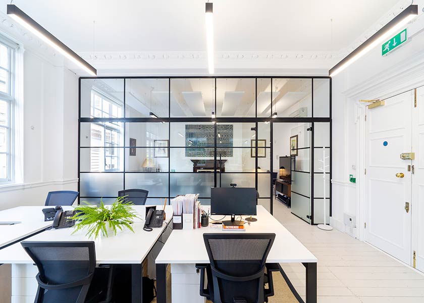 light office rooms seperated by glass wall