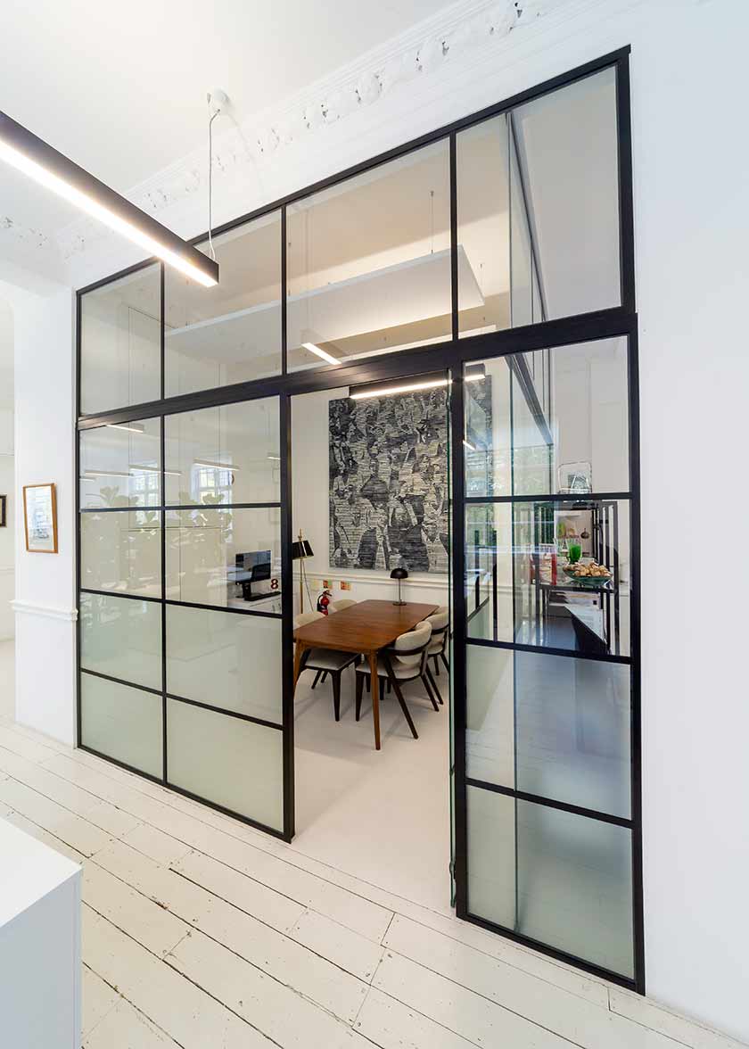 boardroom table viewed through glass doors