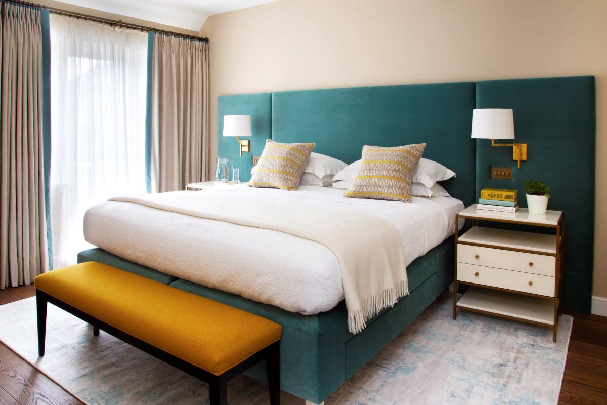 Green and mustard decorated master bedroom